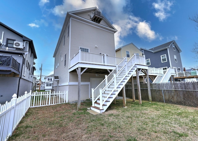 36 Deerfield Ave, Milford, CT 06460 - rear view of property with a fenced backyard, stairs, a yard, and a wooden deck