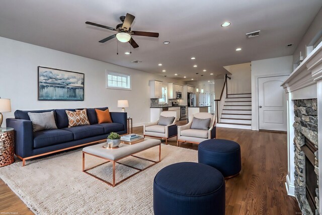 36 Deerfield Ave, Milford, CT 06460 - living area featuring ceiling fan, a fireplace, dark wood finished floors, stairs, and recessed lighting