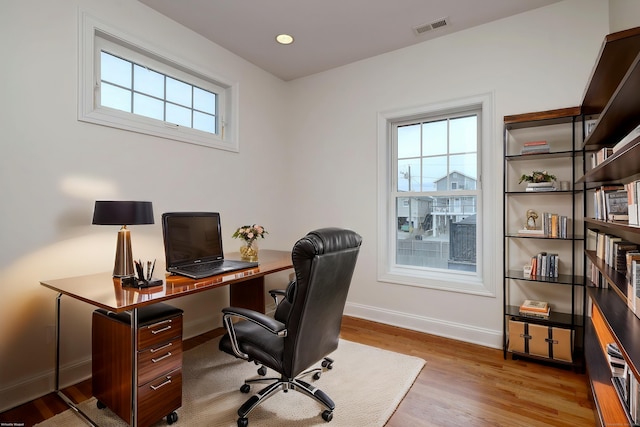 36 Deerfield Ave, Milford, CT 06460 - home office with baseboards, plenty of natural light, wood finished floors, and visible vents