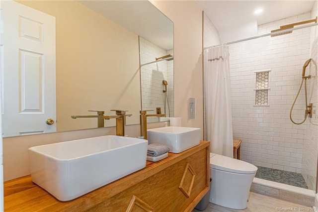 18 Fenway St, Stamford, CT 06902 - bathroom with double vanity, toilet, a tile shower, and a sink