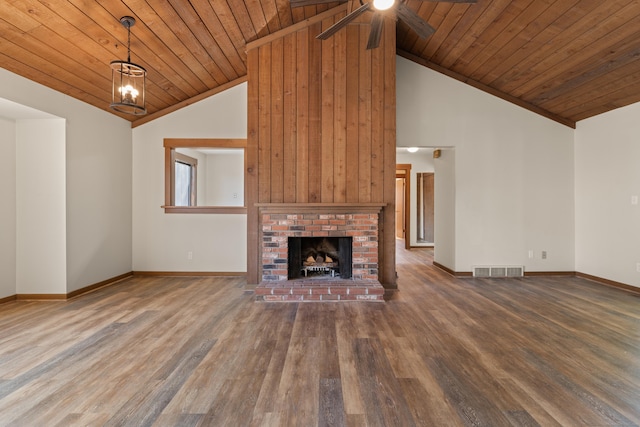 unfurnished living room featuring visible vents, baseboards, wood ceiling, wood finished floors, and a ceiling fan