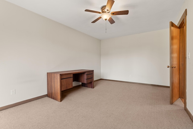 interior space with baseboards and light carpet