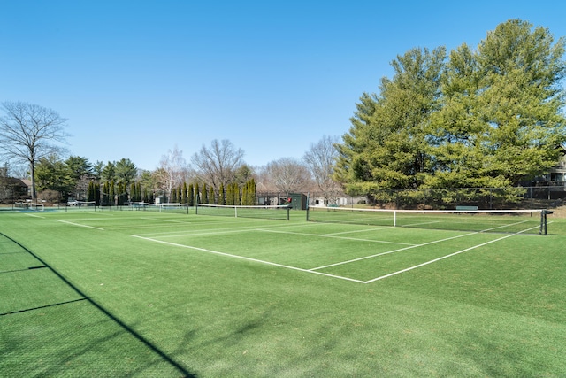 view of tennis court with fence