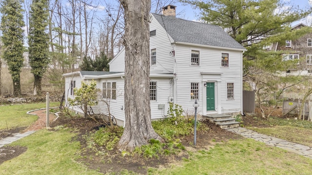 78 Main St, Newtown, CT 06470 - view of front of property featuring roof with shingles, a front yard, and a chimney