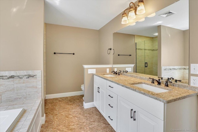 full bathroom featuring toilet, a garden tub, a sink, and a stall shower