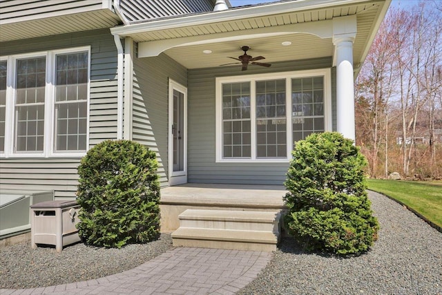 doorway to property featuring a porch and ceiling fan