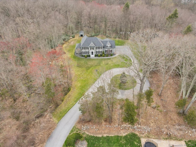 drone / aerial view with a view of trees