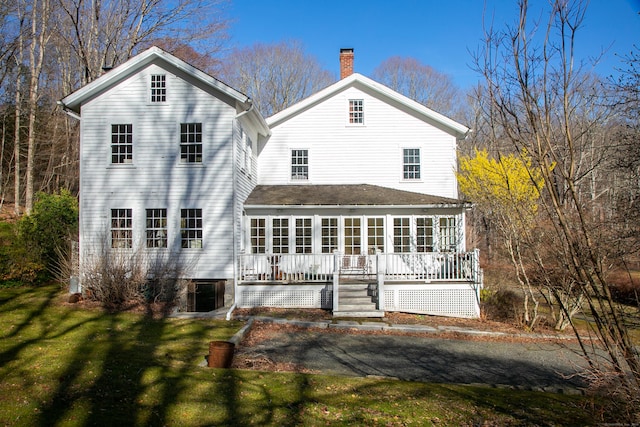 11 Hodge Rd, Roxbury, CT 06783 - back of property featuring a chimney and a lawn