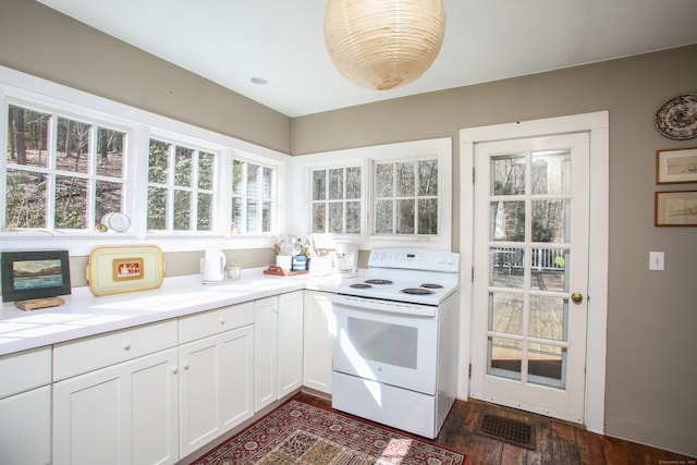 11 Hodge Rd, Roxbury, CT 06783 - kitchen featuring electric range, white cabinets, light countertops, and dark wood finished floors