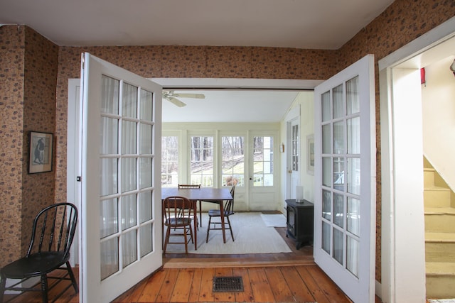 11 Hodge Rd, Roxbury, CT 06783 - sunroom with french doors and a wood stove