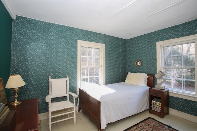 11 Hodge Rd, Roxbury, CT 06783 - bedroom featuring multiple windows, wallpapered walls, wood finished floors, and baseboards