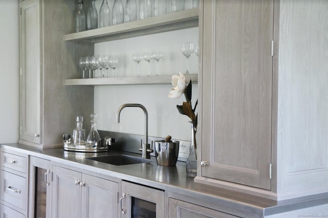 indoor wet bar featuring beverage cooler