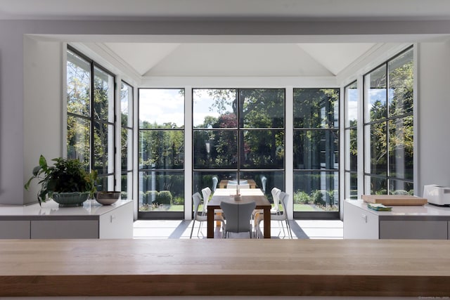 sunroom / solarium with lofted ceiling
