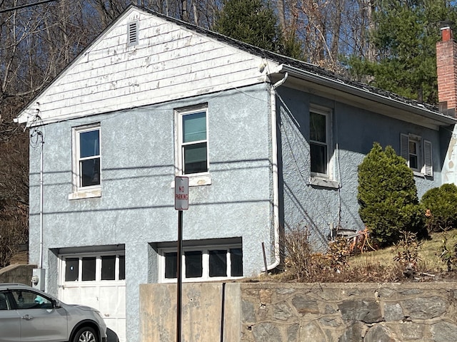 241 Harwinton Ave, Torrington, CT 06790 - view of home's exterior with stucco siding