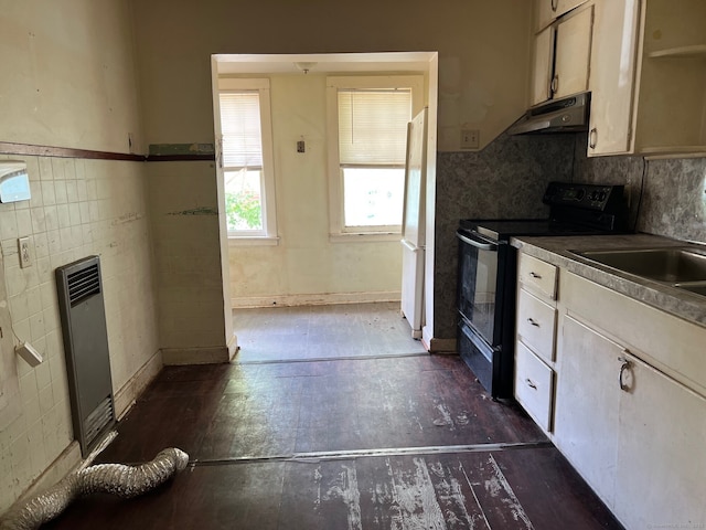 241 Harwinton Ave, Torrington, CT 06790 - kitchen featuring electric range, under cabinet range hood, dark wood finished floors, freestanding refrigerator, and a sink