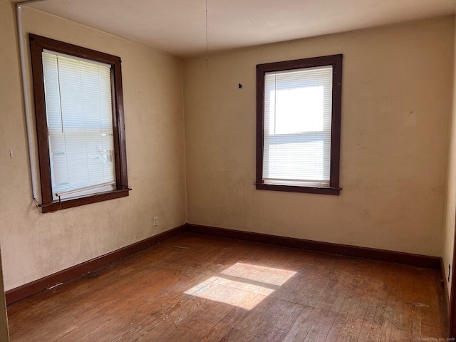 241 Harwinton Ave, Torrington, CT 06790 - unfurnished room with hardwood / wood-style flooring and baseboards