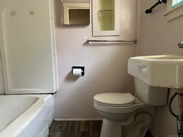 241 Harwinton Ave, Torrington, CT 06790 - bathroom with wood finished floors, toilet, and a bath