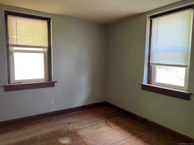 241 Harwinton Ave, Torrington, CT 06790 - unfurnished room featuring hardwood / wood-style floors and baseboards