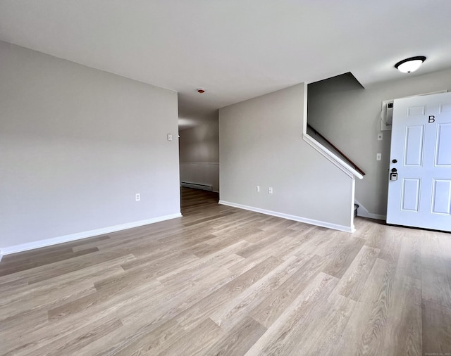 200 Yale St Unit 15B, Waterbury, CT 06704 - interior space with light wood-type flooring, a baseboard heating unit, baseboards, and stairway