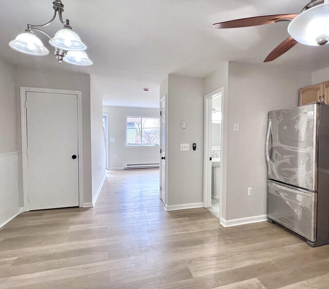 200 Yale St Unit 15B, Waterbury, CT 06704 - kitchen with ceiling fan with notable chandelier, freestanding refrigerator, light wood finished floors, baseboards, and baseboard heating
