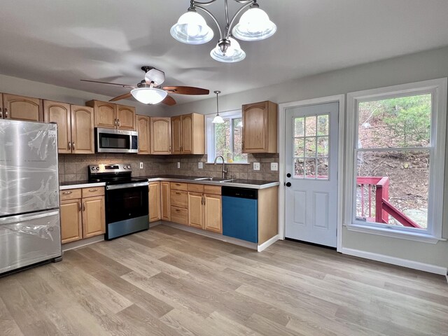 200 Yale St Unit 15B, Waterbury, CT 06704 - kitchen featuring light wood-type flooring, a sink, decorative light fixtures, appliances with stainless steel finishes, and decorative backsplash