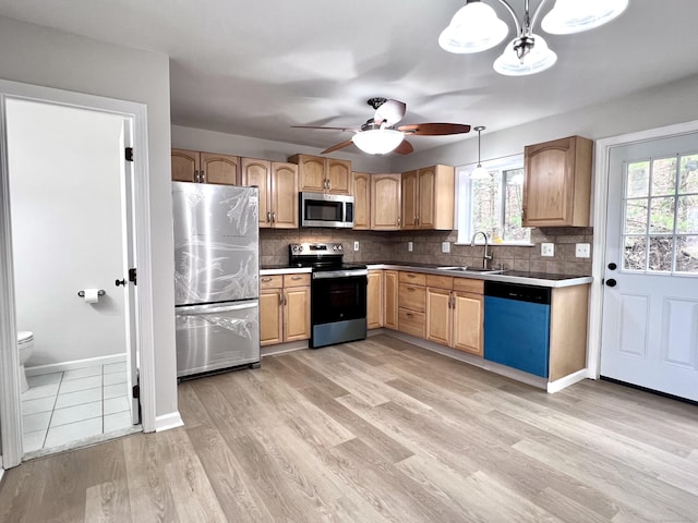 200 Yale St Unit 15B, Waterbury, CT 06704 - kitchen with a sink, decorative backsplash, light wood-type flooring, and stainless steel appliances