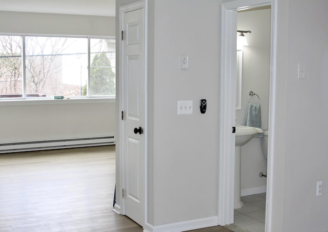 200 Yale St Unit 15B, Waterbury, CT 06704 - hall with wood finished floors, baseboards, and a baseboard radiator