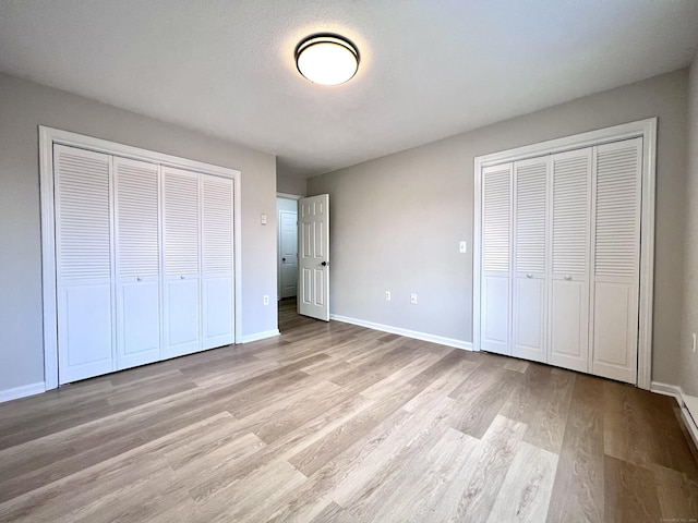 200 Yale St Unit 15B, Waterbury, CT 06704 - unfurnished bedroom with light wood finished floors and baseboards