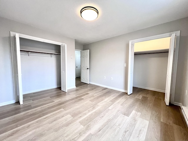 200 Yale St Unit 15B, Waterbury, CT 06704 - unfurnished bedroom with baseboards and wood finished floors