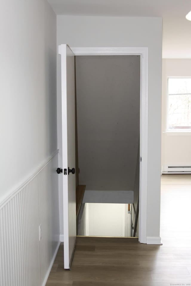 200 Yale St Unit 15B, Waterbury, CT 06704 - hall with wood finished floors, a baseboard radiator, and wainscoting