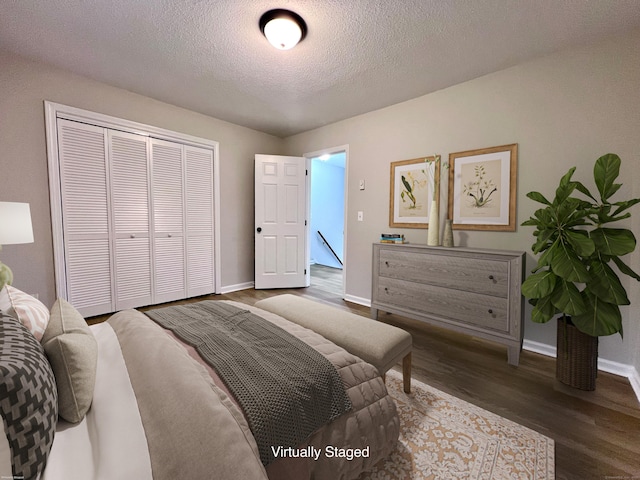 200 Yale St Unit 15B, Waterbury, CT 06704 - bedroom with a closet, baseboards, a textured ceiling, and wood finished floors