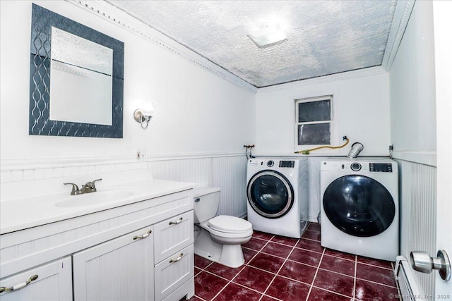25 Jefferson Dr, New Milford, CT 06776 - bathroom with a baseboard radiator, tile patterned floors, a wainscoted wall, toilet, and independent washer and dryer