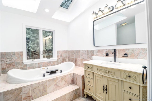 25 Jefferson Dr, New Milford, CT 06776 - full bathroom featuring a garden tub, a skylight, and vanity