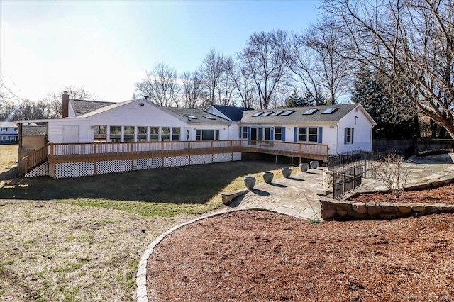 25 Jefferson Dr, New Milford, CT 06776 - rear view of property with a patio area, solar panels, a yard, and a deck