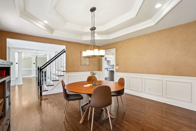 250 Valley Stream Ln, Southbury, CT 06488 - dining area with crown molding, dark wood-style flooring, wainscoting, a raised ceiling, and stairway