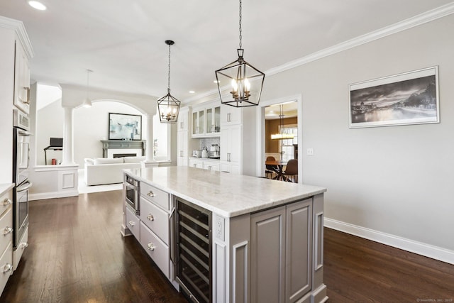 250 Valley Stream Ln, Southbury, CT 06488 - kitchen with wine cooler, dark wood-type flooring, a chandelier, white cabinets, and recessed lighting