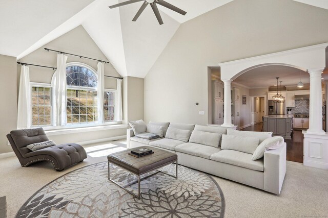 250 Valley Stream Ln, Southbury, CT 06488 - living room featuring decorative columns, ceiling fan, arched walkways, light carpet, and lofted ceiling