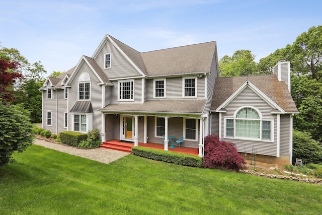250 Valley Stream Ln, Southbury, CT 06488 - view of front of home with a chimney, covered porch, a front yard, and a shingled roof