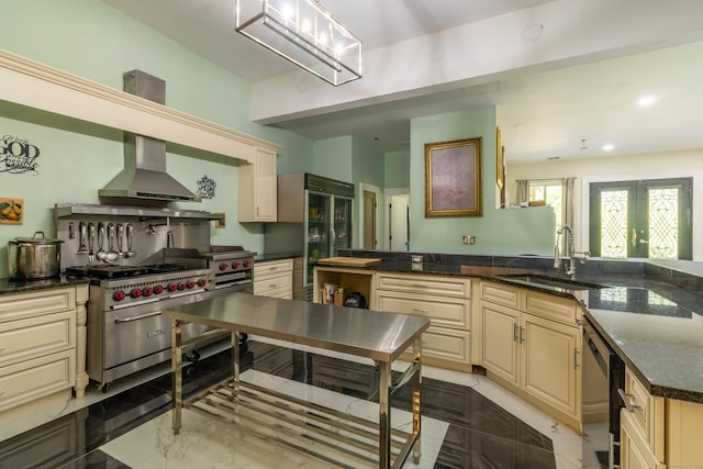 8 Tom Rd, East Haddam, CT 06423 - kitchen with appliances with stainless steel finishes, cream cabinets, wall chimney range hood, dark stone countertops, and recessed lighting