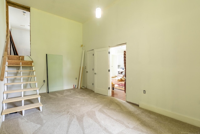 8 Tom Rd, East Haddam, CT 06423 - unfurnished room featuring carpet floors and a towering ceiling