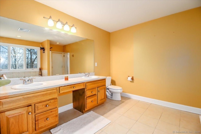 bathroom with double vanity, visible vents, a shower stall, and a sink
