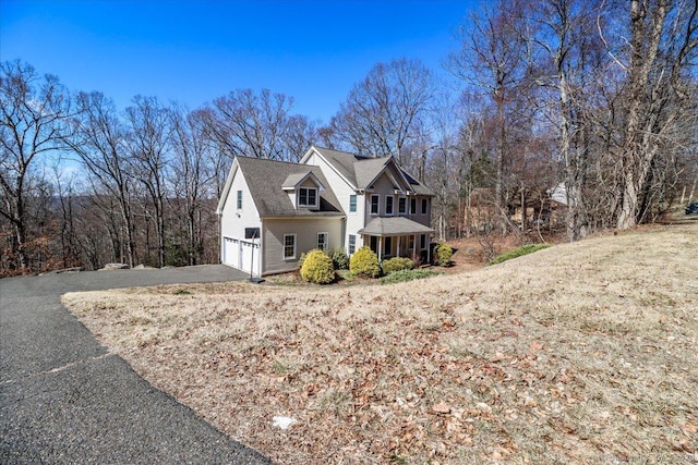 view of front of house featuring driveway and a garage