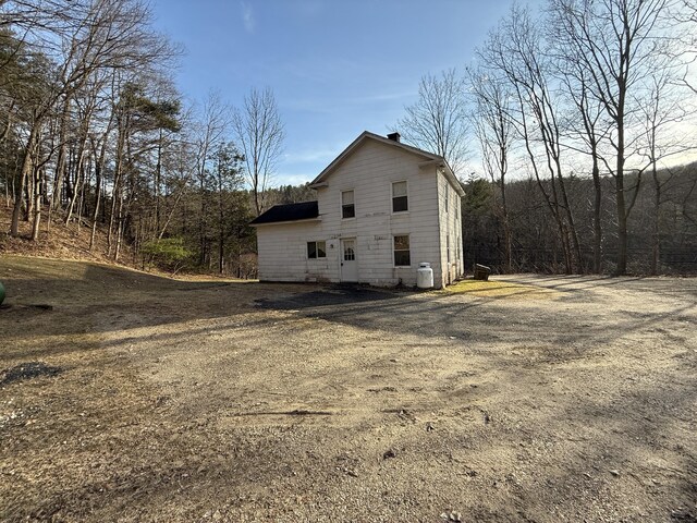 226 Greenwoods Rd W, Norfolk, CT 06058 - view of side of home with a chimney