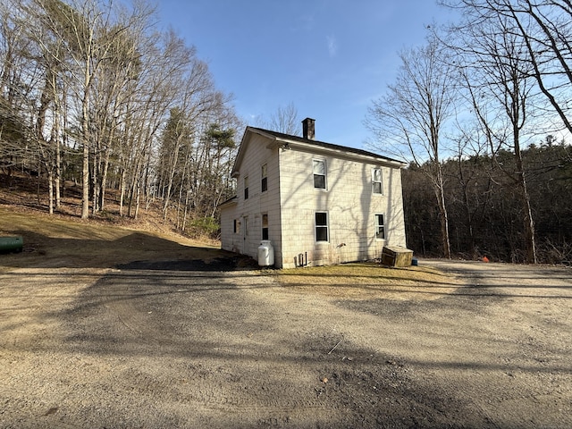 226 Greenwoods Rd W, Norfolk, CT 06058 - view of home's exterior with central AC and a chimney