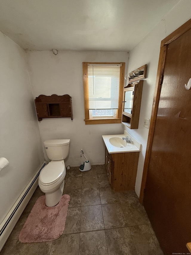 226 Greenwoods Rd W, Norfolk, CT 06058 - bathroom featuring tile patterned flooring, vanity, toilet, and a baseboard heating unit