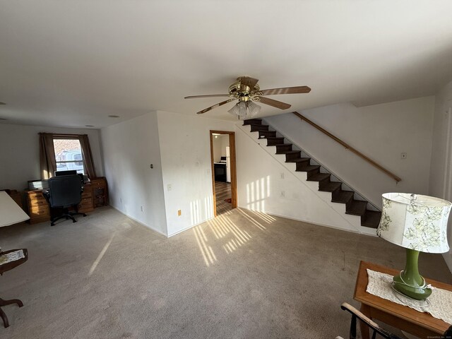 226 Greenwoods Rd W, Norfolk, CT 06058 - unfurnished living room with stairway, carpet floors, and ceiling fan