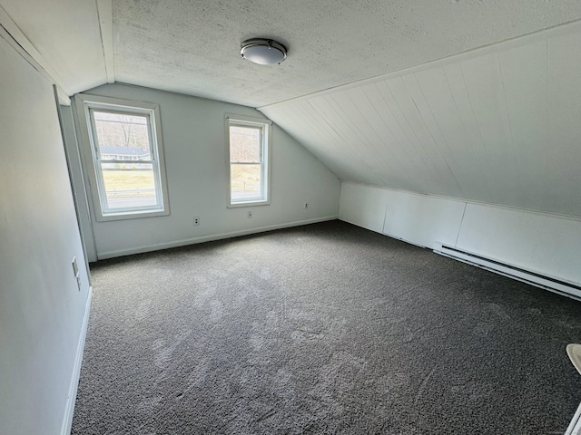 19 Huntington Rd, Scotland, CT 06264 - bonus room featuring lofted ceiling, carpet, baseboard heating, baseboards, and a textured ceiling