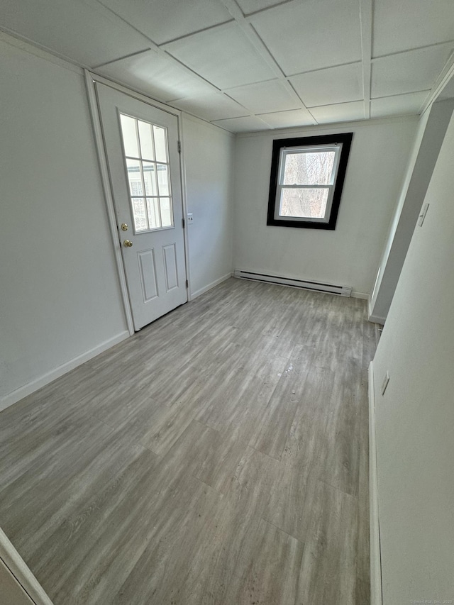 19 Huntington Rd, Scotland, CT 06264 - empty room featuring baseboard heating, wood finished floors, and baseboards
