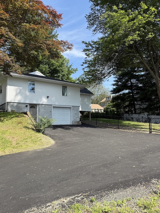 8 Hubbard Rd, North Branford, CT 06471 - view of side of property with an attached garage and asphalt driveway