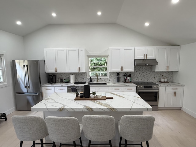 8 Hubbard Rd, North Branford, CT 06471 - kitchen with stainless steel appliances, under cabinet range hood, a sink, a breakfast bar area, and recessed lighting
